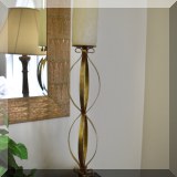 DF01. One of a pair of gold tone candlesticks.